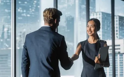 Businesswoman and man making handshake