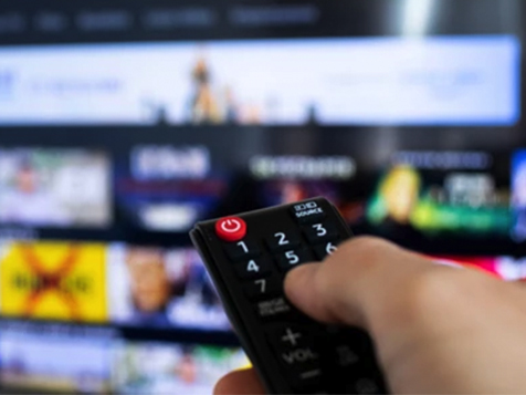 Closeup view of a person's hand with remote