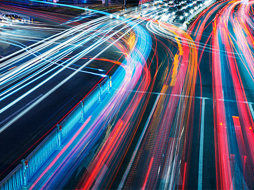 Car lights traveling through traffic