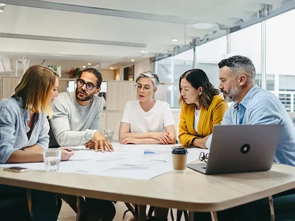 FIve collegues having a discussion