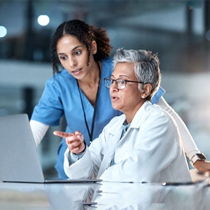 Two doctors discussing patient records